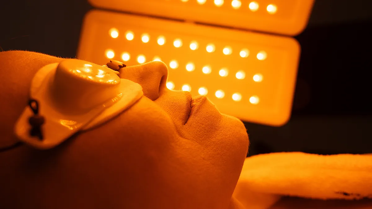 Women getting a LED facial treatment